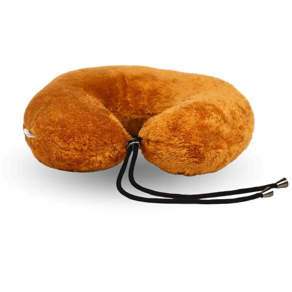 Golden travel neck pillow with a black cord, designed for comfort during journeys.