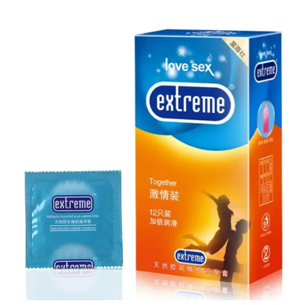 24 A box of Extreme Together condoms, containing 12 pieces, next to a packet of assorted condoms on a flat surface.