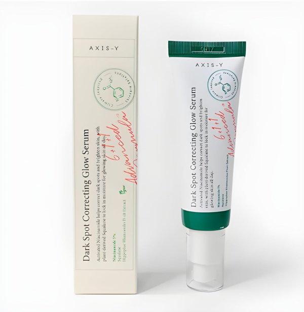 A tube of AXIS-Y Dark Spot Correcting Glow Serum 5% next to its box, showcasing the product's packaging and branding.