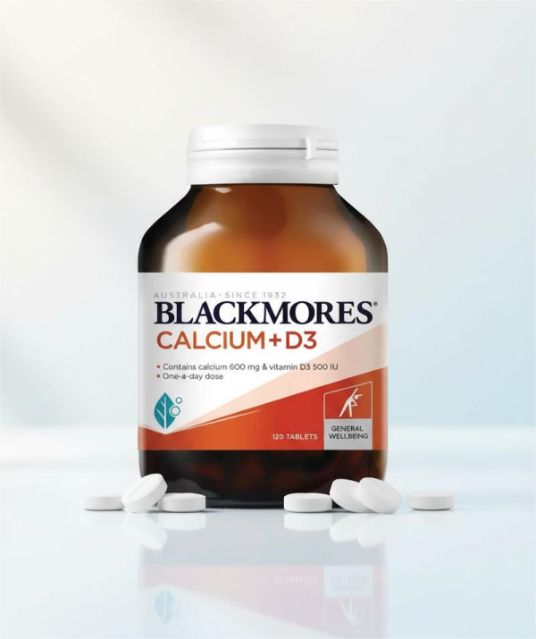 Blackmores Calcium Magnesium D3 supplement bottle with a white label and green accents, promoting bone health.