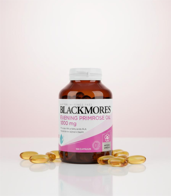 Blackmores Evening Primrose vitamin supplement bottle on a pink background.