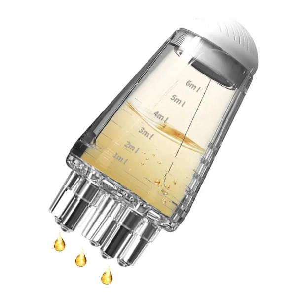 Glass bottle containing hair oil, designed as a scalp applicator with a comb for massaging the scalp.