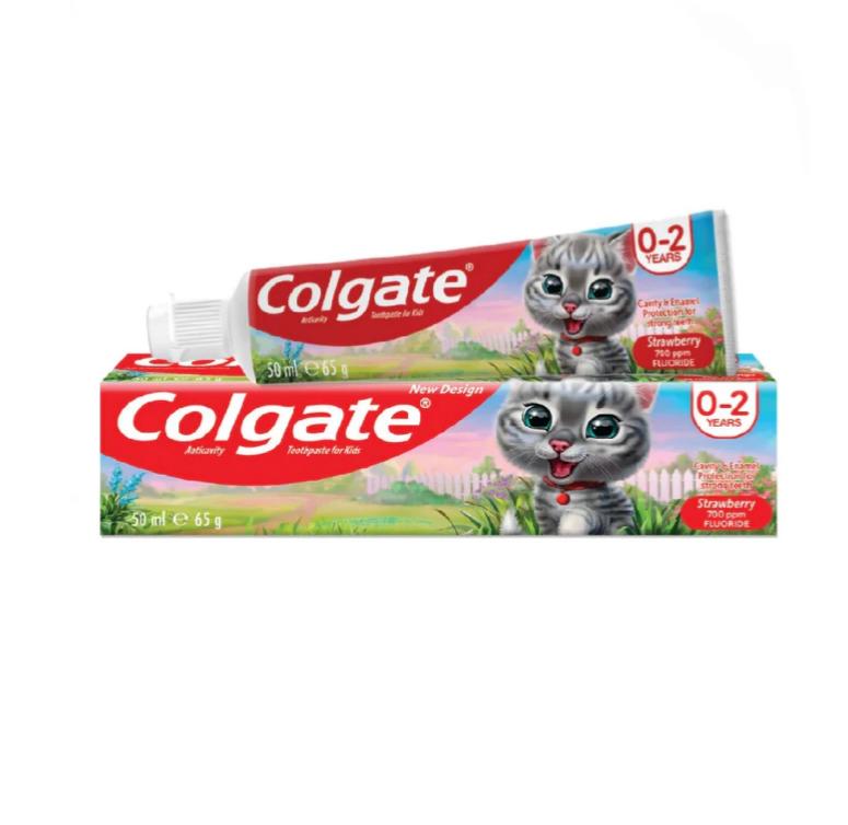579 (1) Colgate Kids Strawberry Toothpaste (0-2 Years) featuring a playful cat on the packaging, 65g size.