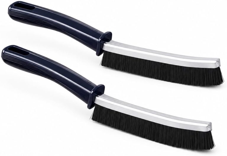 Two durable grout cleaning brushes, one black and one white, displayed on a white surface for tile and corner cleaning.
