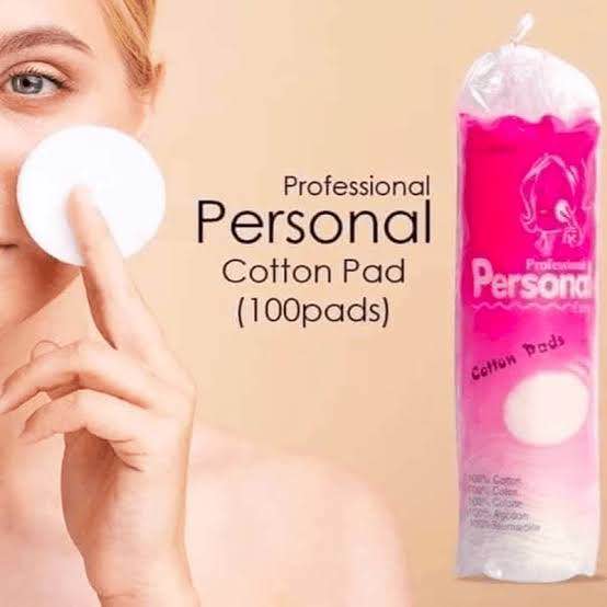 Pack of 100 professional cotton pads for personal care, displayed on a clean white background.